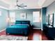 Stylish main bedroom featuring a tray ceiling, ceiling fan and windows for natural light at 18018 Malakai Isle Dr, Tampa, FL 33647