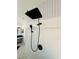 Contemporary shower featuring stylish black hardware and eye-catching geometric-patterned wallpaper at 18018 Malakai Isle Dr, Tampa, FL 33647