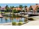 Beautiful waterfront homes with private docks and patios along a tranquil canal, framed by lush palm trees at 18018 Malakai Isle Dr, Tampa, FL 33647