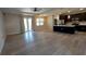Spacious living room area showcasing hardwood floors, natural light, and an open view to the kitchen at 3269 Ponce De Leon Blvd, North Port, FL 34291