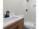 Modern bathroom featuring white marble shower, wood cabinet, and dark accents at 404 Courtney Dr, Temple Terrace, FL 33617