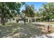 Charming single-story home featuring a brick mailbox and covered front parking area at 404 Courtney Dr, Temple Terrace, FL 33617