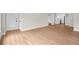 Light filled living room with light hardwood floors and an open floorplan at 404 Courtney Dr, Temple Terrace, FL 33617