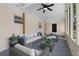 Staged screened porch featuring patio furniture and a ceiling fan at 404 Courtney Dr, Temple Terrace, FL 33617