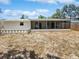 Spacious backyard with a screened-in lanai, perfect for outdoor living and entertaining at 7604 Tyson Dr, Port Richey, FL 34668