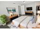 Bright bedroom with a large bed, stylish furnishings, and a walk-in closet for ample storage space at 7604 Tyson Dr, Port Richey, FL 34668