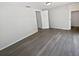 Bright, unfurnished bedroom with wood-look flooring and a spacious closet at 7604 Tyson Dr, Port Richey, FL 34668