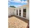 Inviting entrance with a decorative tiled floor and freshly painted white exterior at 7604 Tyson Dr, Port Richey, FL 34668