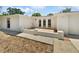 Well-maintained home exterior featuring a brick patio and manicured landscaping at 7604 Tyson Dr, Port Richey, FL 34668