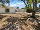 This home has a good amount of space in the front yard, with mature trees offering shade at 7604 Tyson Dr, Port Richey, FL 34668