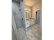 This elegant bathroom features marble tile and a glass enclosed shower at 9 Bunker Pl, Rotonda West, FL 33947