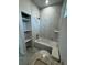 This stylish bathroom has a granite vanity, tile floors, and tiled shower at 9 Bunker Pl, Rotonda West, FL 33947