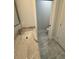 This bathroom has gray tile floors and a granite vanity at 9 Bunker Pl, Rotonda West, FL 33947