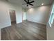 This bright bedroom has wood floors, recessed lighting, and a walk-in closet at 9 Bunker Pl, Rotonda West, FL 33947