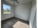 This bedroom features modern flooring and a large window at 9 Bunker Pl, Rotonda West, FL 33947