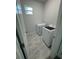 This functional laundry room has a tile floor and modern washer and dryer at 9 Bunker Pl, Rotonda West, FL 33947