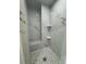 This modern shower has a mosaic tile floor and marble tile surround at 9 Bunker Pl, Rotonda West, FL 33947