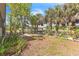 Expansive backyard with tropical landscaping, boat dock and access to the canal at 18430 Alphonse Cir, Port Charlotte, FL 33948
