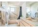 Standard bathroom including a shower, bathtub and vanity sink at 18430 Alphonse Cir, Port Charlotte, FL 33948