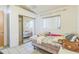 Comfortable bedroom featuring a mirrored closet and tile flooring at 18430 Alphonse Cir, Port Charlotte, FL 33948