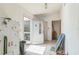 View of the home's entryway, showcasing the front door, tile flooring, and access to other rooms at 18430 Alphonse Cir, Port Charlotte, FL 33948