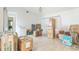 A spacious living room filled with moving boxes; bright light with a relaxing atmosphere at 18430 Alphonse Cir, Port Charlotte, FL 33948