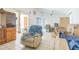 Spacious living room with vaulted ceiling, tile floors, natural light, and room to relax and entertain at 18430 Alphonse Cir, Port Charlotte, FL 33948
