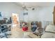 An ample-sized living room featuring tile floors and an archway to the kitchen at 18430 Alphonse Cir, Port Charlotte, FL 33948