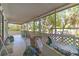 A screened in porch overlooking tropical landscaping and canal at 18430 Alphonse Cir, Port Charlotte, FL 33948