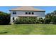 Spacious backyard with a well-manicured lawn and a charming patio, ideal for outdoor activities at 302 Coco Plum Ct, Oldsmar, FL 34677