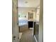 Bathroom showcasing a soaking tub, glass enclosed shower, dark vanity, large mirror, and hardwood floors at 302 Coco Plum Ct, Oldsmar, FL 34677
