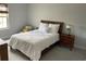 Comfortable bedroom features queen sized bed and a bench seat at 302 Coco Plum Ct, Oldsmar, FL 34677