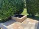 Cozy backyard fire pit with stone surround, perfect for enjoying cool evenings outdoors at 302 Coco Plum Ct, Oldsmar, FL 34677