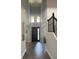 Grand foyer with high ceilings, decorative lighting, wood floors, and an elegant staircase at 302 Coco Plum Ct, Oldsmar, FL 34677