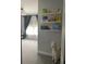 Charming hallway with bookshelf decor leading to a sunny room at 302 Coco Plum Ct, Oldsmar, FL 34677