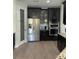 Gourmet kitchen featuring stainless steel appliances, dark cabinetry, and a convenient pantry at 302 Coco Plum Ct, Oldsmar, FL 34677
