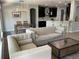 Open-concept living space with living room, dining area, and kitchen featuring modern decor at 302 Coco Plum Ct, Oldsmar, FL 34677