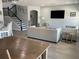 Spacious and open living space with staircase, living room, dining area, and kitchen island at 302 Coco Plum Ct, Oldsmar, FL 34677