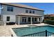 Beautiful backyard pool with spacious patio and outdoor seating area, perfect for entertaining or relaxing at 302 Coco Plum Ct, Oldsmar, FL 34677