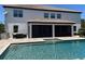 Backyard pool and patio with covered dining area, ideal for entertaining and relaxing in style at 302 Coco Plum Ct, Oldsmar, FL 34677