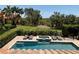 Inviting backyard pool and spa with lounge chairs, perfect for relaxing and enjoying the scenic views at 302 Coco Plum Ct, Oldsmar, FL 34677