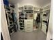 Spacious walk-in closet with custom shelving and ample storage at 302 Coco Plum Ct, Oldsmar, FL 34677