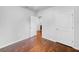 A bright room with hardwood floors and a closet space for storage at 10956 Carlton Fields Dr, Riverview, FL 33579