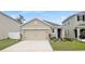 Charming single-Gathering home featuring a two-car garage and well-maintained front lawn at 10956 Carlton Fields Dr, Riverview, FL 33579