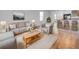 Bright and airy living room featuring neutral decor, comfortable seating, and a cozy rug at 10956 Carlton Fields Dr, Riverview, FL 33579