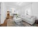 Open concept living room featuring light bright paint, hardwood floors, and modern decor at 1426 Erie S St, St Petersburg, FL 33712