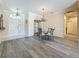 Inviting dining room featuring hardwood floors, a decorative chandelier, and stylish decor at 1913 Blue River Rd, Holiday, FL 34691