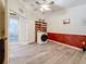 Laundry room with wood-look flooring, modern washer and some storage at 1913 Blue River Rd, Holiday, FL 34691