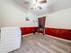 Bright laundry room with wood-look flooring and a modern washer at 1913 Blue River Rd, Holiday, FL 34691
