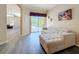 Spacious living room featuring a sectional sofa, sliding doors with views of the pool, and wood-look floors at 1913 Blue River Rd, Holiday, FL 34691
